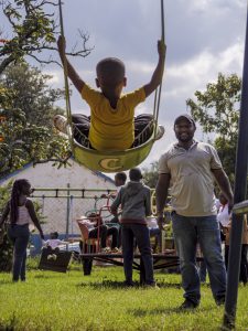 _1696817 Child enjoying playtime at the Family Fun Day for Autism Families Nairobi, supported by Phoenix Capital.
